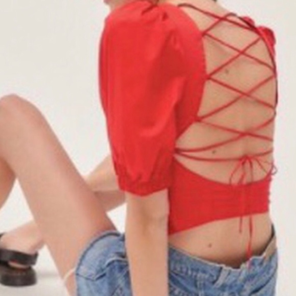 Strappy open back puff sleeve blouse. Never worn.